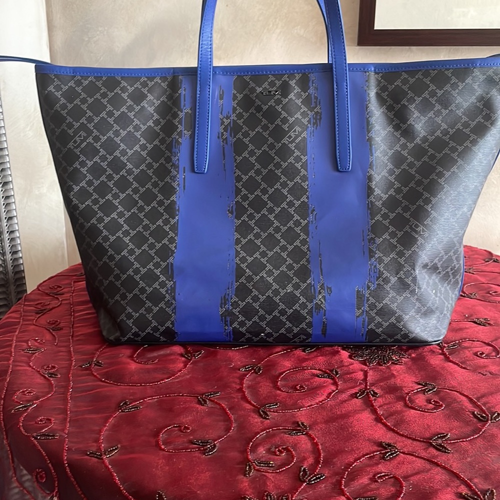 Tumi tote bag in beautiful grayish and vibrant blue canvas and leather trim.